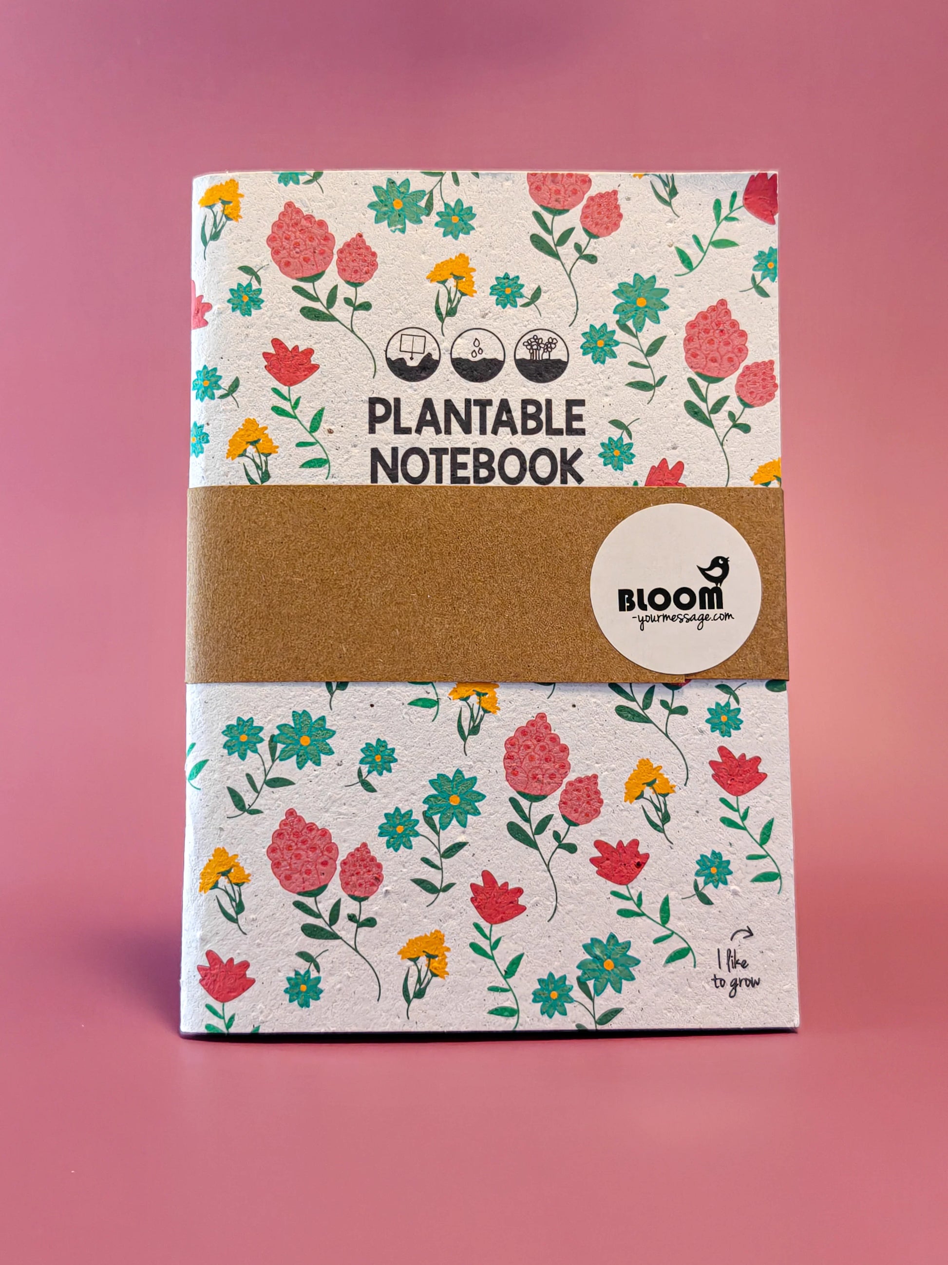 Plantbaar notitieboek met bloemenprint op roze achtergrond, duurzaam cadeau-idee